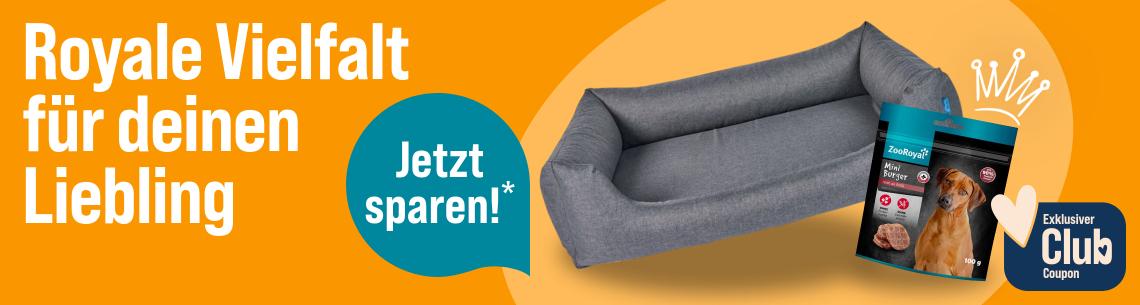Royale Vielfalt für deinen Liebling Werbebanner für die ZooRoyal Eigenmarke mit dem Schriftzug „Royale Vielfalt für deinen Liebling“. Abgebildet sind ein graues Hundebett und Hundesnacks der Marke ZooRoyal. Ein Hinweis hebt hervor: „Jetzt sparen!*“. Zusätzlich wird ein exklusiver Club-Coupon beworben.