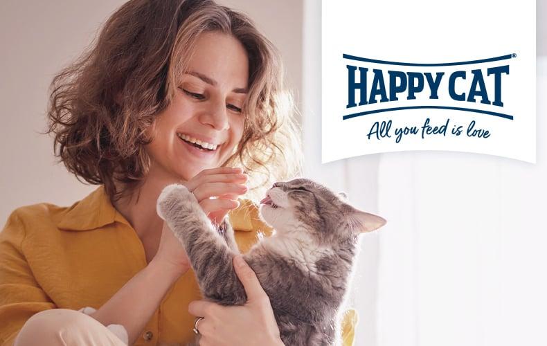 Topbanner Happy Cat Person hält eine Katze, daneben Happy Cat Logo.