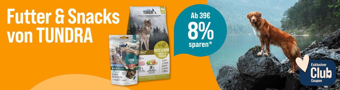 Spare 8% ab 39€ auf Hundefutter von TUNDRA Aktionsbanner für TUNDRA Hundefutter und Snacks: Ein Hund steht auf einem Felsen am Wasser. Text: ‚Futter & Snacks von TUNDRA‘, ‚Ab 39 € 8 % sparen‘ und ‚Exklusiver Club Coupon‘.